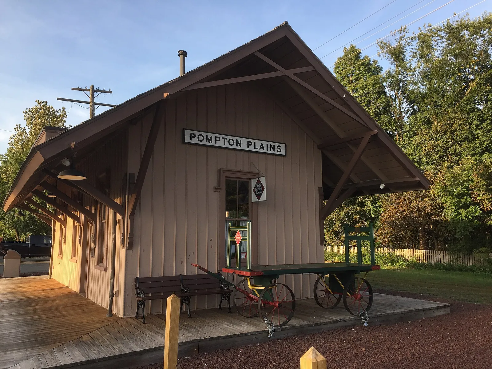 The old Pompton Plains railroad station with a baggage wagon on its platform