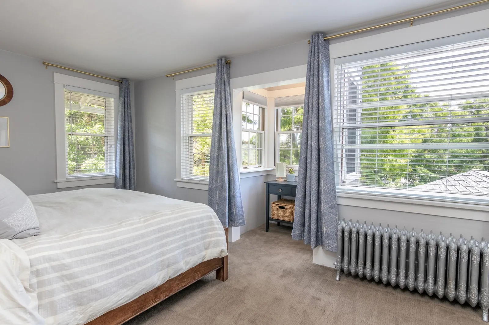 Cast iron radiator under the windows of a bedroom
